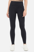 Audrie Legging, alternate angle view, showing visible design features and texture of the stretch knit fabric.. #color_black