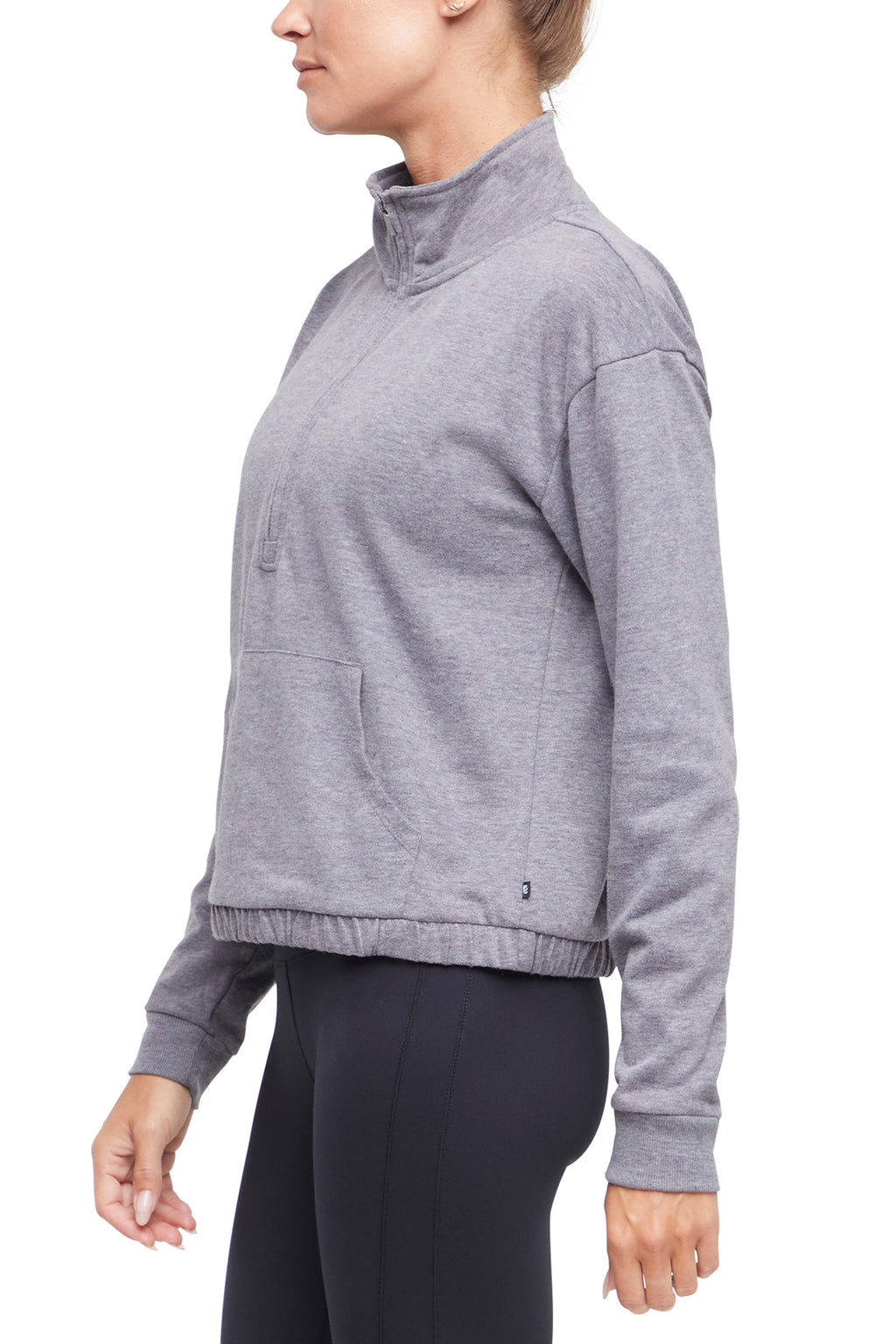 Lyla 1/2 Zip Pullover, close-up view of fabric and stitching, showing visible design features and texture of the soft knit fabric.. #color_heather-charcoal
