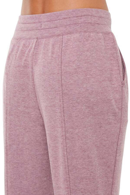 Lyla Jogger, side view showing pocket placement, showing visible design features and texture of the soft knit fabric.. 