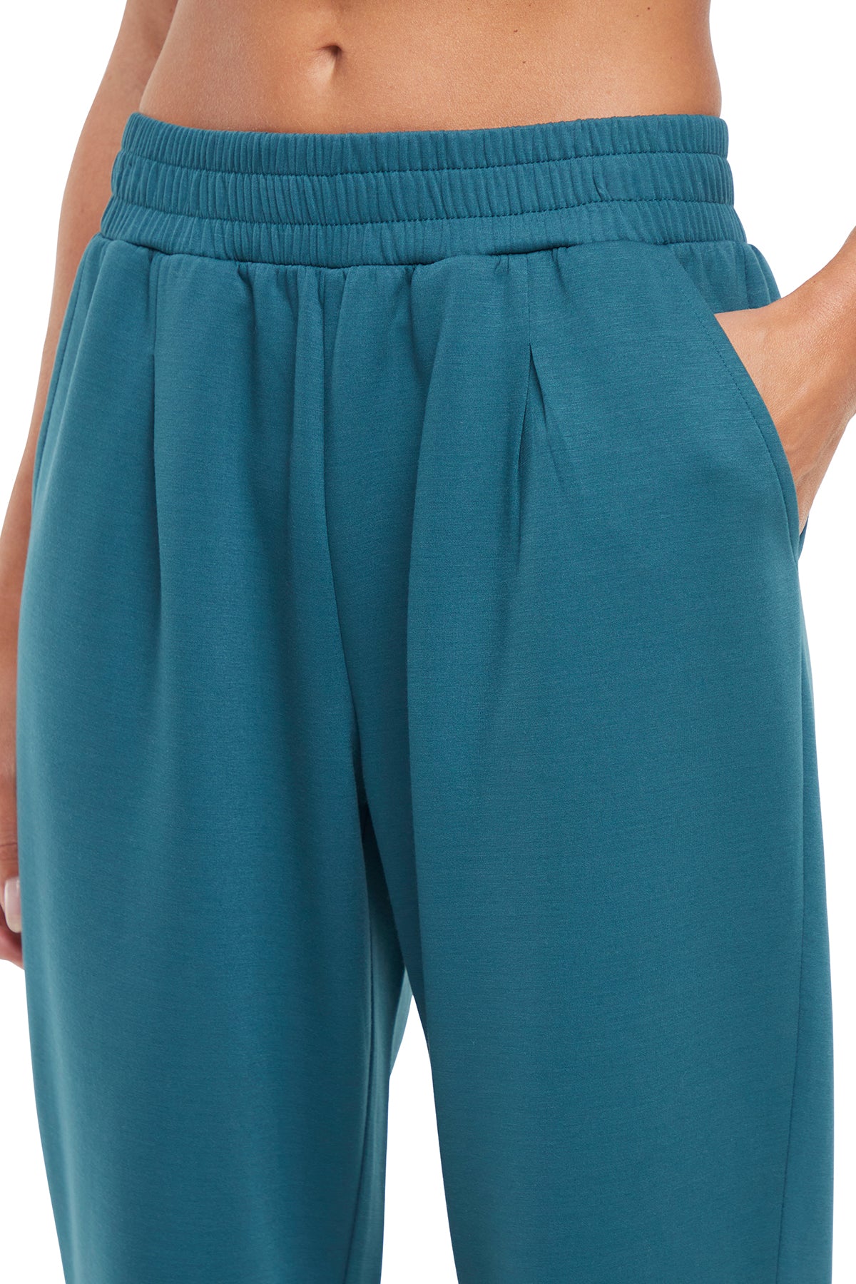 Sage Jogger, close-up view of fabric and stitching, showing visible design features and texture of the soft knit fabric..