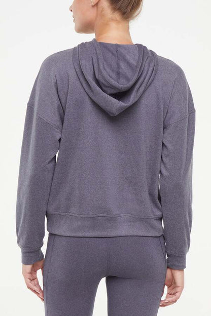 Riley Hoodie, alternate angle view, showing visible design features and texture of the soft fleece fabric.. 