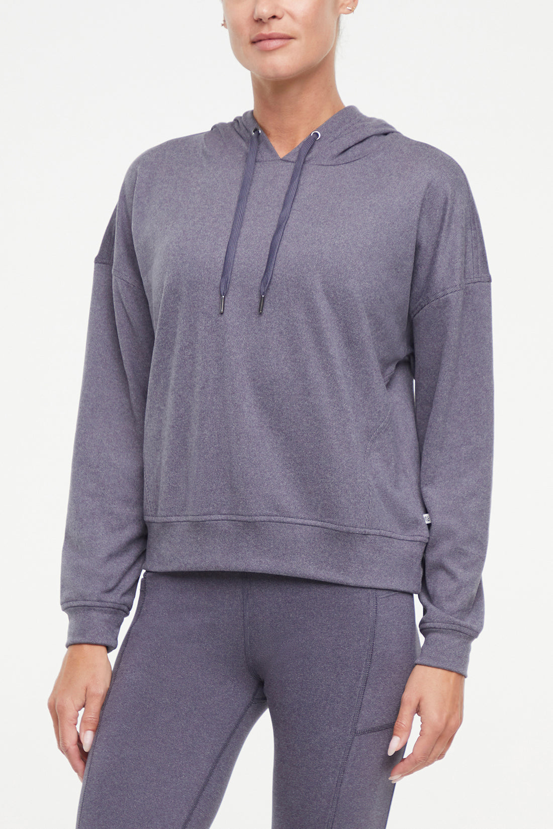 Riley Hoodie, alternate angle view, showing visible design features and texture of the soft fleece fabric..