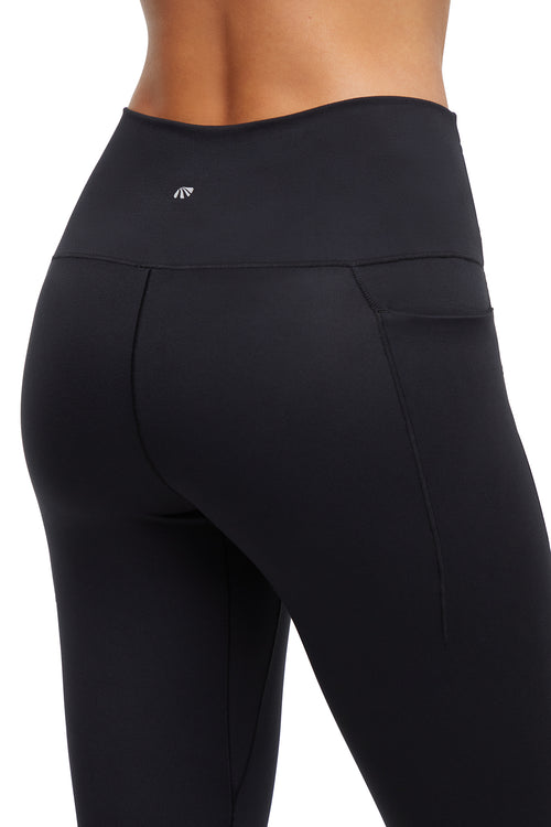 Kelly Side Pocket Legging, alternate angle view, showing visible design features and texture of the stretch knit fabric.. #color_black