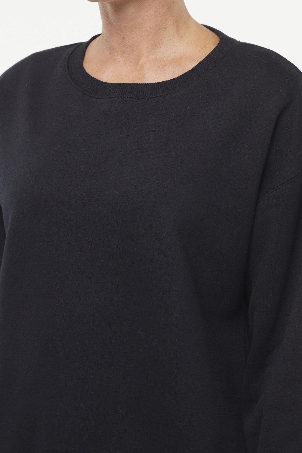 Camila Pullover, back view, showing visible design features and texture of the soft knit fabric.. #color_black