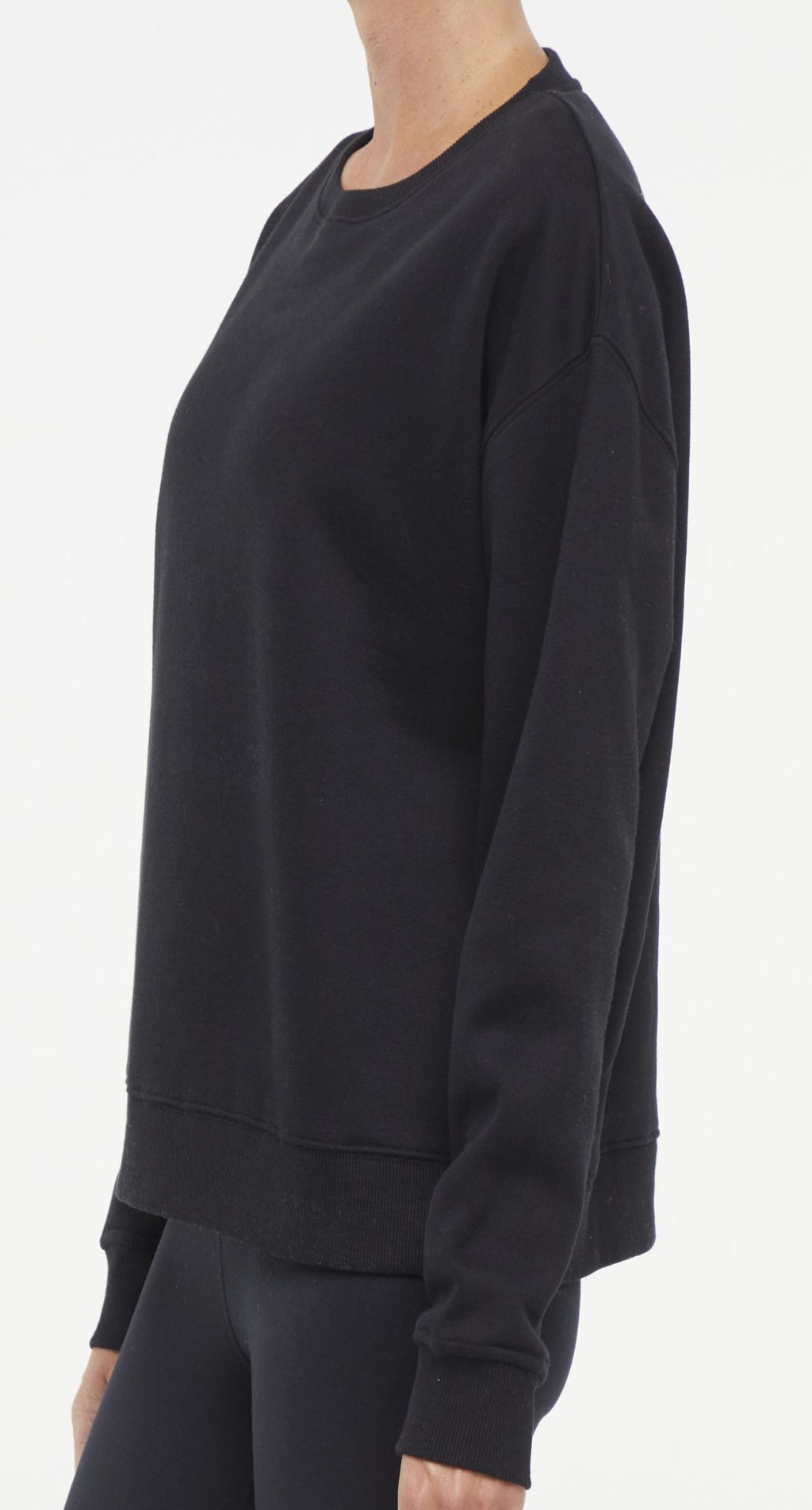 Camila Pullover, close-up view of fabric and stitching, showing visible design features and texture of the soft knit fabric.. #color_black