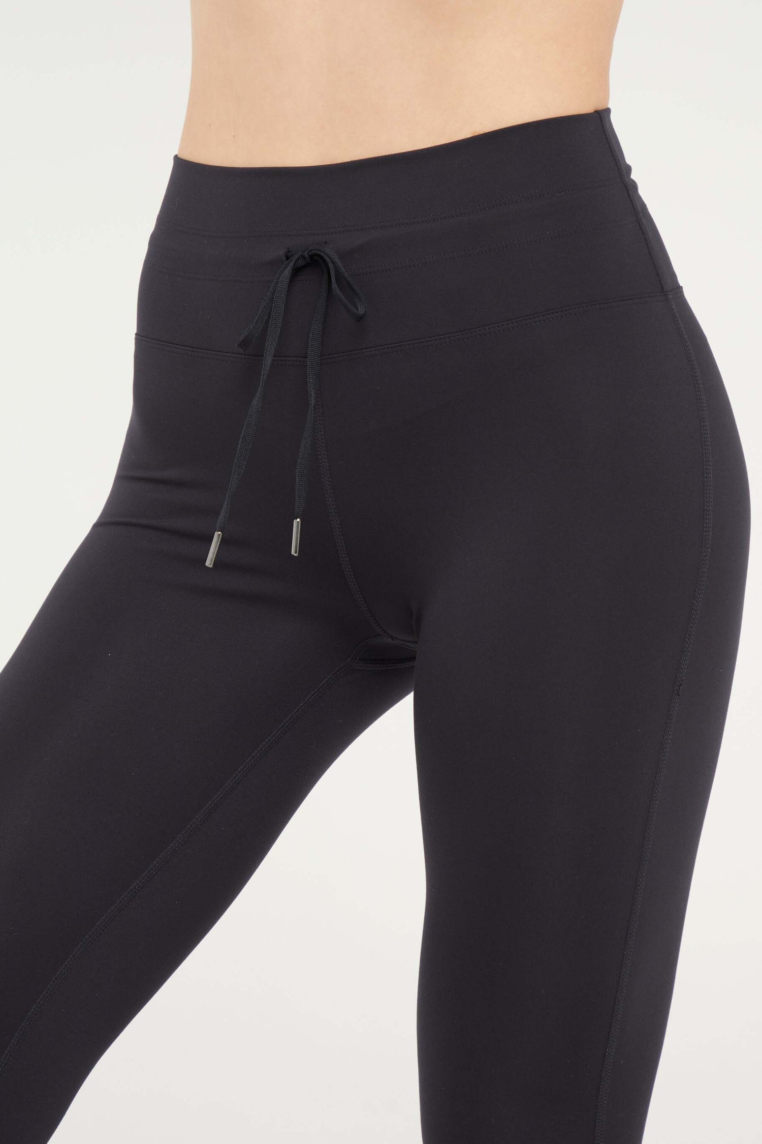 Lune Legging, alternate angle view, showing visible design features and texture of the stretch knit fabric.. 
