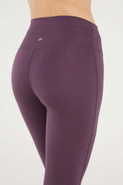 Lune Legging, side view showing pocket placement, showing visible design features and texture of the stretch knit fabric.. 