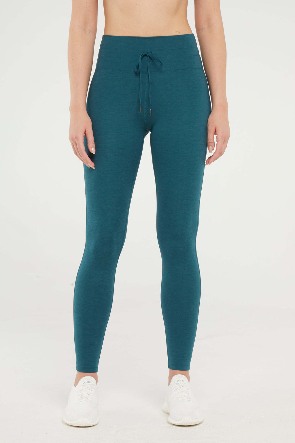 Lune Legging, alternate angle view, showing visible design features and texture of the stretch knit fabric.. #color_heather-dark-sea
