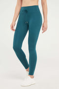 Lune Legging, alternate angle view, showing visible design features and texture of the stretch knit fabric.. #color_heather-dark-sea