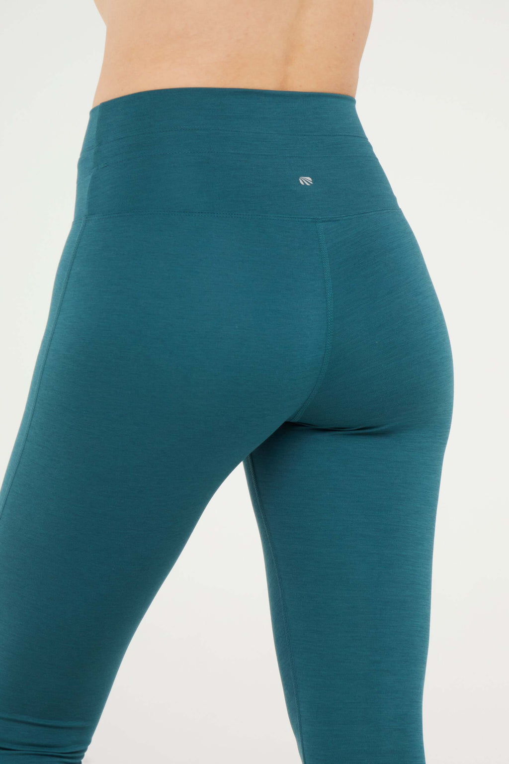 Lune Legging, alternate angle view, showing visible design features and texture of the stretch knit fabric.. #color_heather-dark-sea
