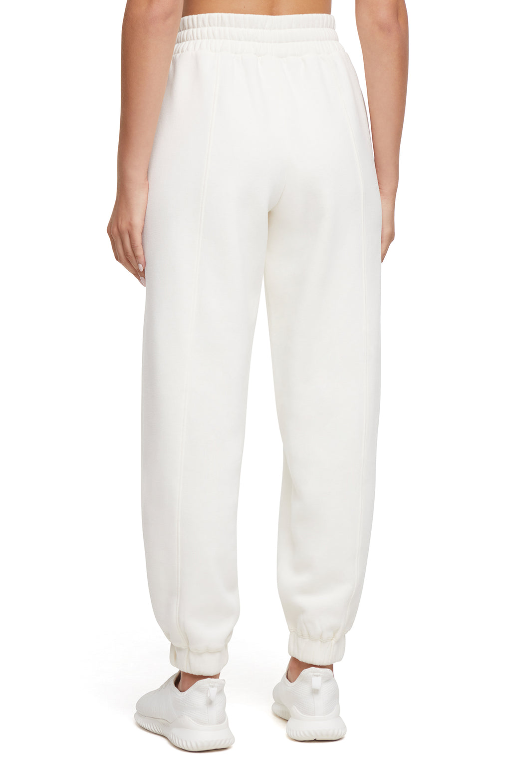 Calliope Jogger, side view showing pocket placement, showing visible design features and texture of the soft knit fabric.. #color_egret