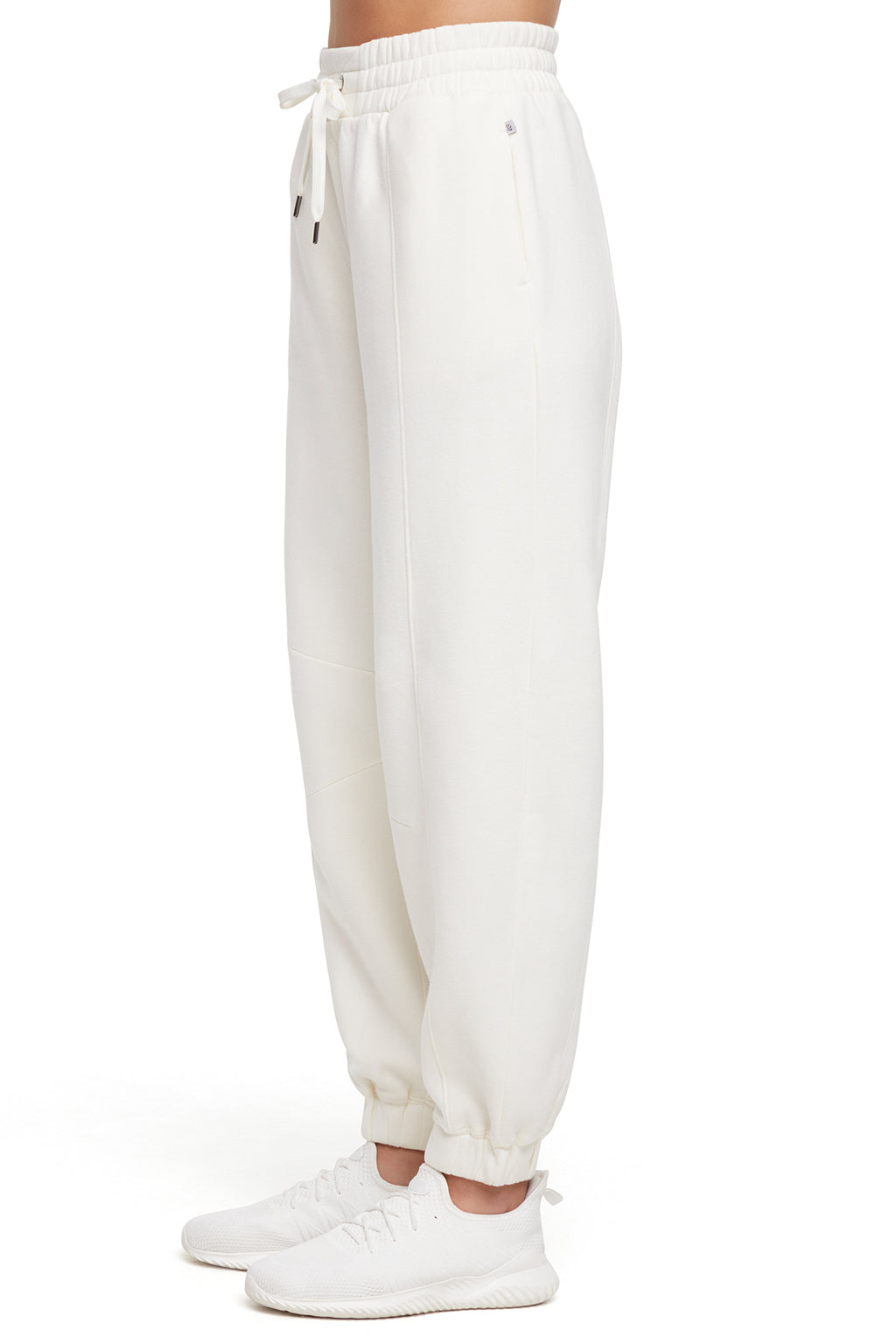 Calliope Jogger, alternate angle view, showing visible design features and texture of the soft knit fabric.. #color_egret