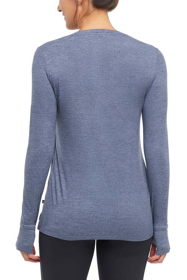 Harper Long Sleeve Top, side view showing pocket placement, showing visible design features and texture of the soft knit fabric.. 