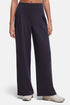 A model wearing dark navy wide-leg pleated trousers and light beige sneakers, shown from the waist down against a light gray studio background. 