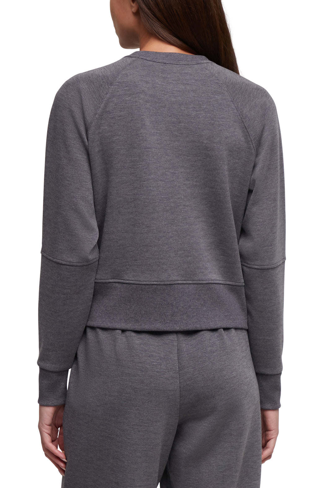 A woman shown from the back wearing a dark heather gray long-sleeve cropped sweatshirt and matching sweatpants against a plain white background. #color_heather-black
