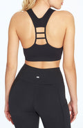 Haley Seamless Sports Bra, front view, showing visible design features and texture of the soft knit fabric.. #color_black