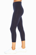 Carrie Tummy Control Mid Calf Capri, front view, showing visible design features and texture of the soft knit fabric.. #color_midnight-blue