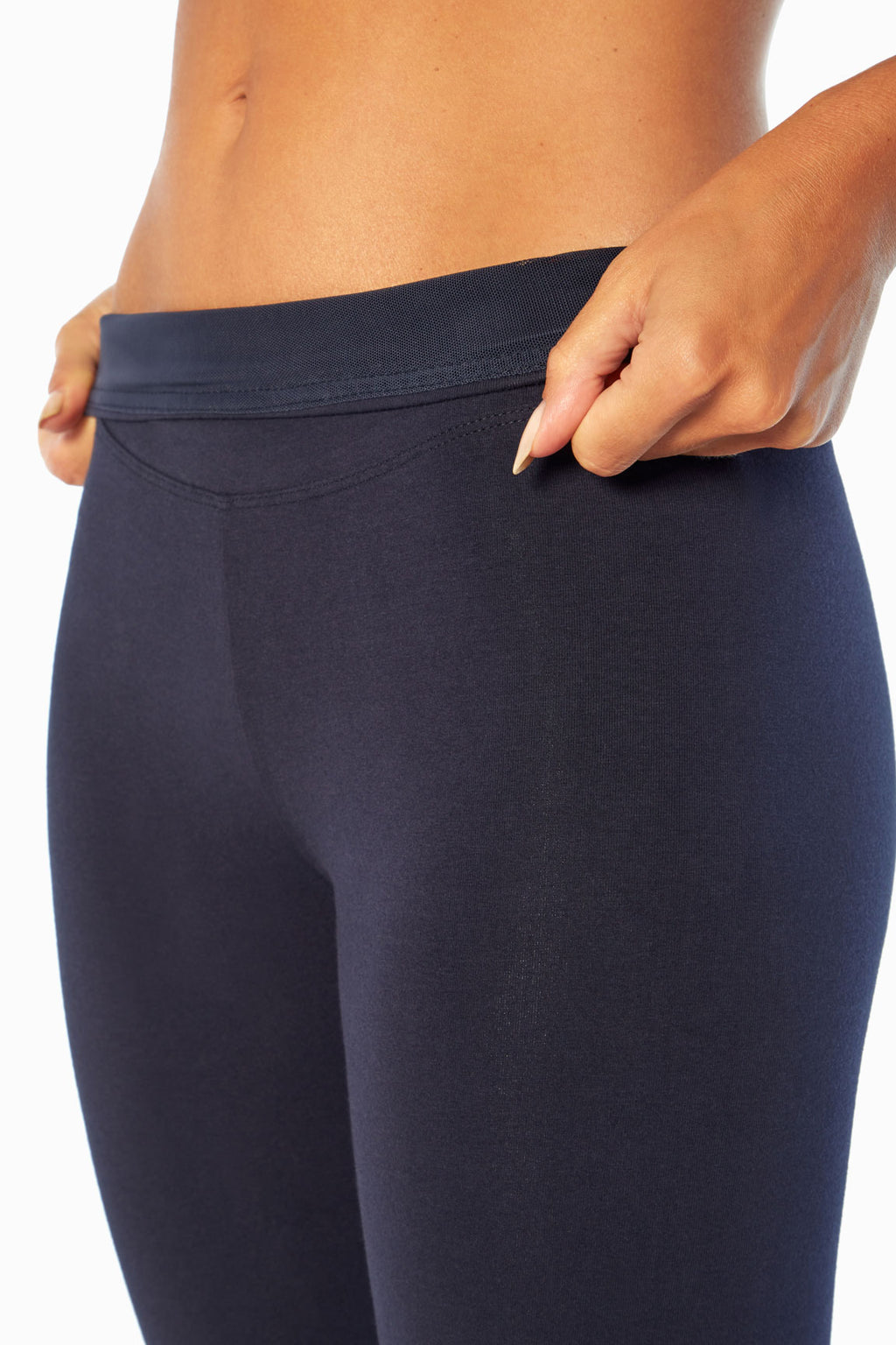 Carrie Tummy Control Mid Calf Capri, back view, showing visible design features and texture of the soft knit fabric.. #color_midnight-blue
