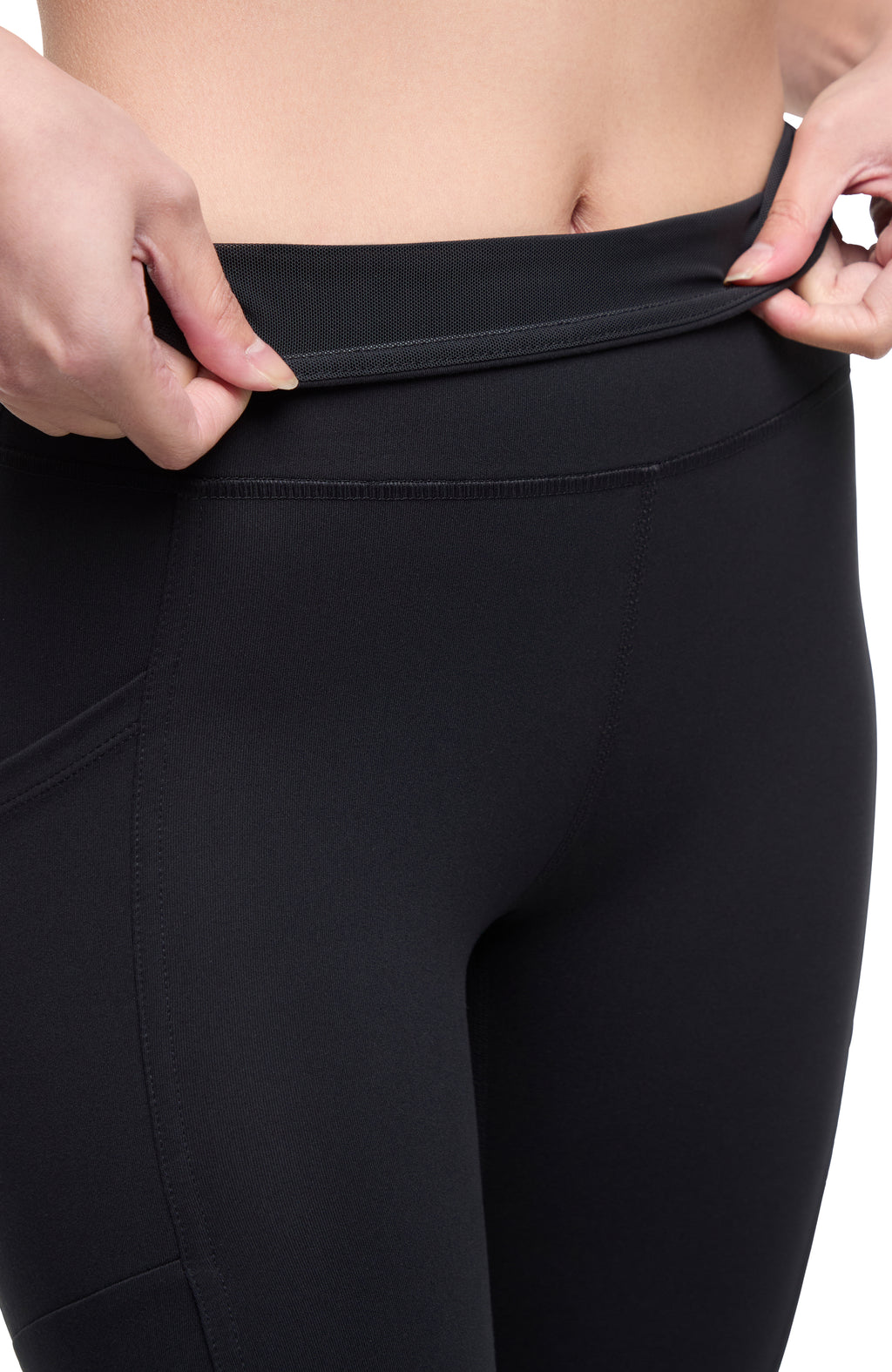 Drew Side Pocket Tummy Control Mid Calf Capri, alternate angle view, showing visible design features and texture of the soft knit fabric. #color_black