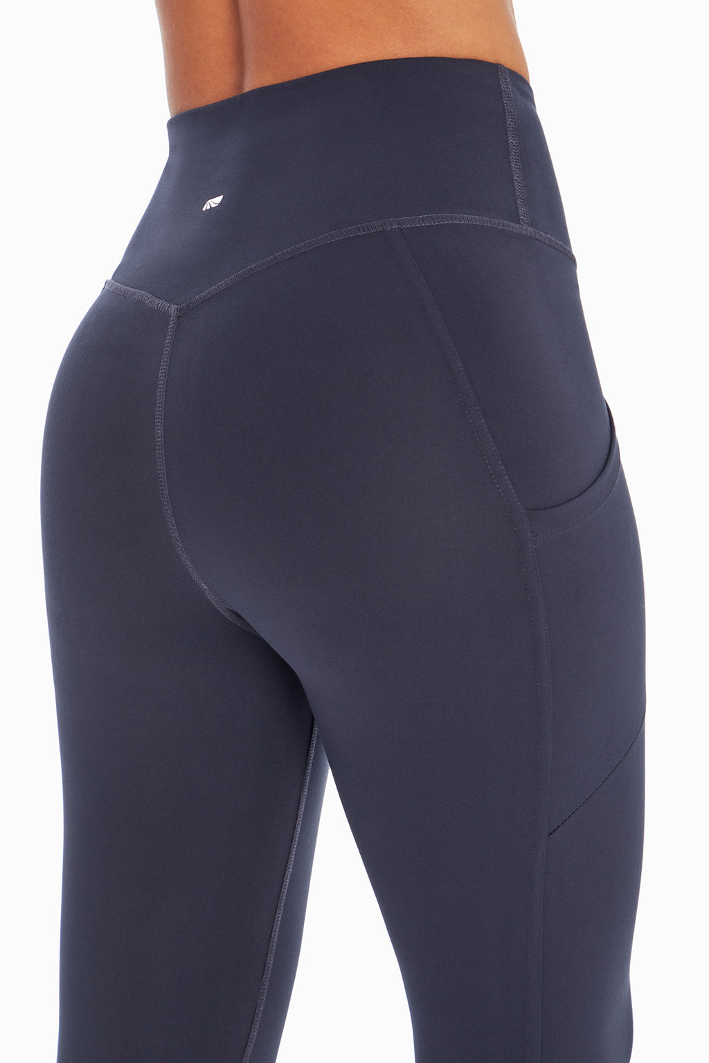 Drew Side Pocket Tummy Control Mid Calf Capri, alternate angle view, showing visible design features and texture of the soft knit fabric.. #color_midnight-blue