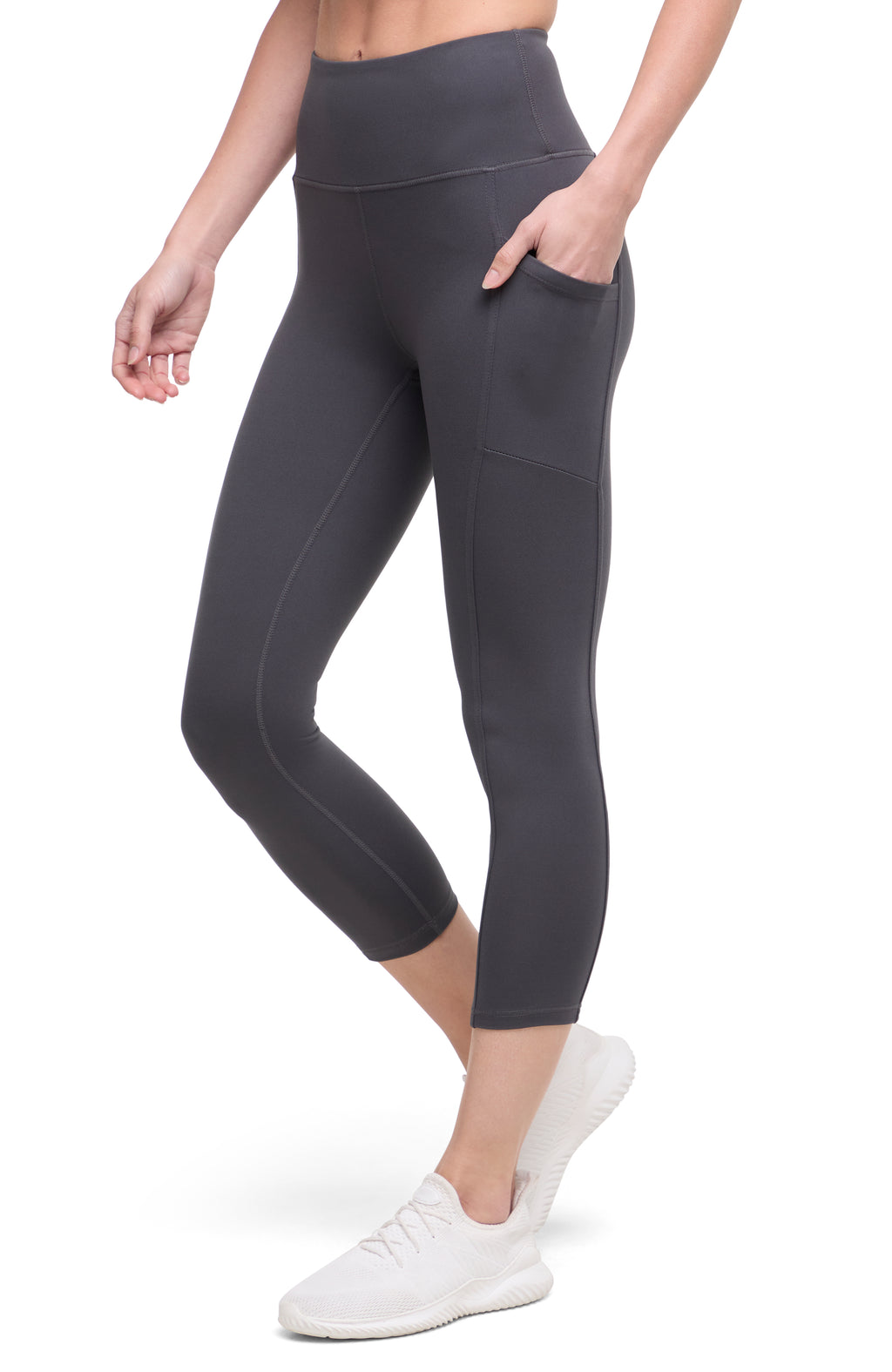 Front of woman wearing dark gray leggings with a white background. #color_forged-iron