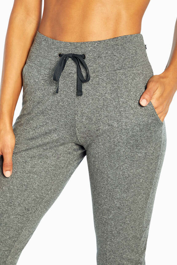 Mona Capri, close-up view of fabric and stitching, showing visible design features and texture of the soft knit fabric.. #color_heather-black