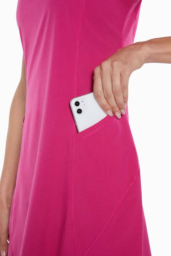 Jadelyn Active Dress, side view showing pocket placement, showing visible design features and texture of the soft knit fabric.. 