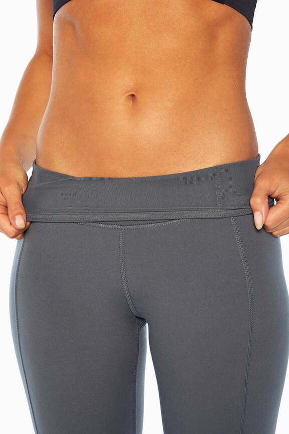 Olivia High Rise Tummy Control Legging - Turbulence, side view showing pocket placement, showing visible design features and texture of the stretch.. #color_turbulence