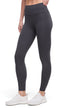 Front view of woman wearing dark gray leggings with a white background. 