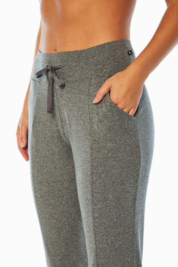 Mona Jogger, close-up view of fabric and stitching, showing visible design features and texture of the soft knit fabric.. #color_heather-black