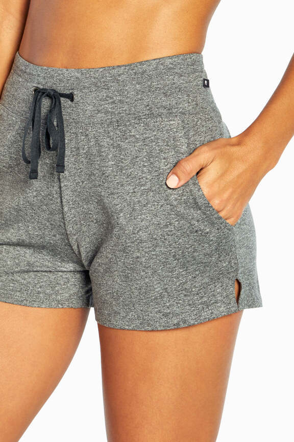 Mona Short, close-up view of fabric and stitching, showing visible design features and texture of the soft knit fabric.. 