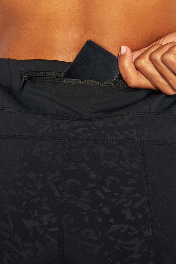 All Trek Side Pocket Shorts, side view showing pocket placement, showing visible design features and texture of the soft knit fabric.. 