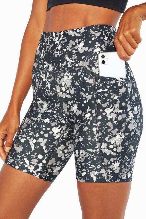 Luna Side Pocket Short, close-up view of fabric and stitching, showing visible design features and texture of the soft knit fabric.. 