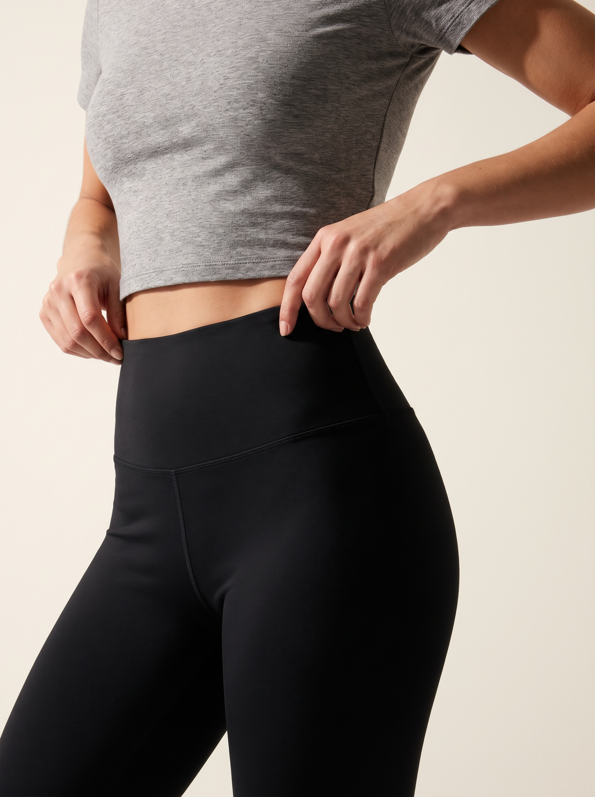 Close-up of the wide smoothing high-rise waistband on black tummy control leggings