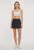 Hazel Woven Skort, alternate angle view, showing visible design features and texture of the soft knit fabric. #color_black