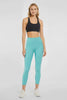 Video view of woman wearing light turquoise leggings worn by a person on a white background. #color_agate-green
