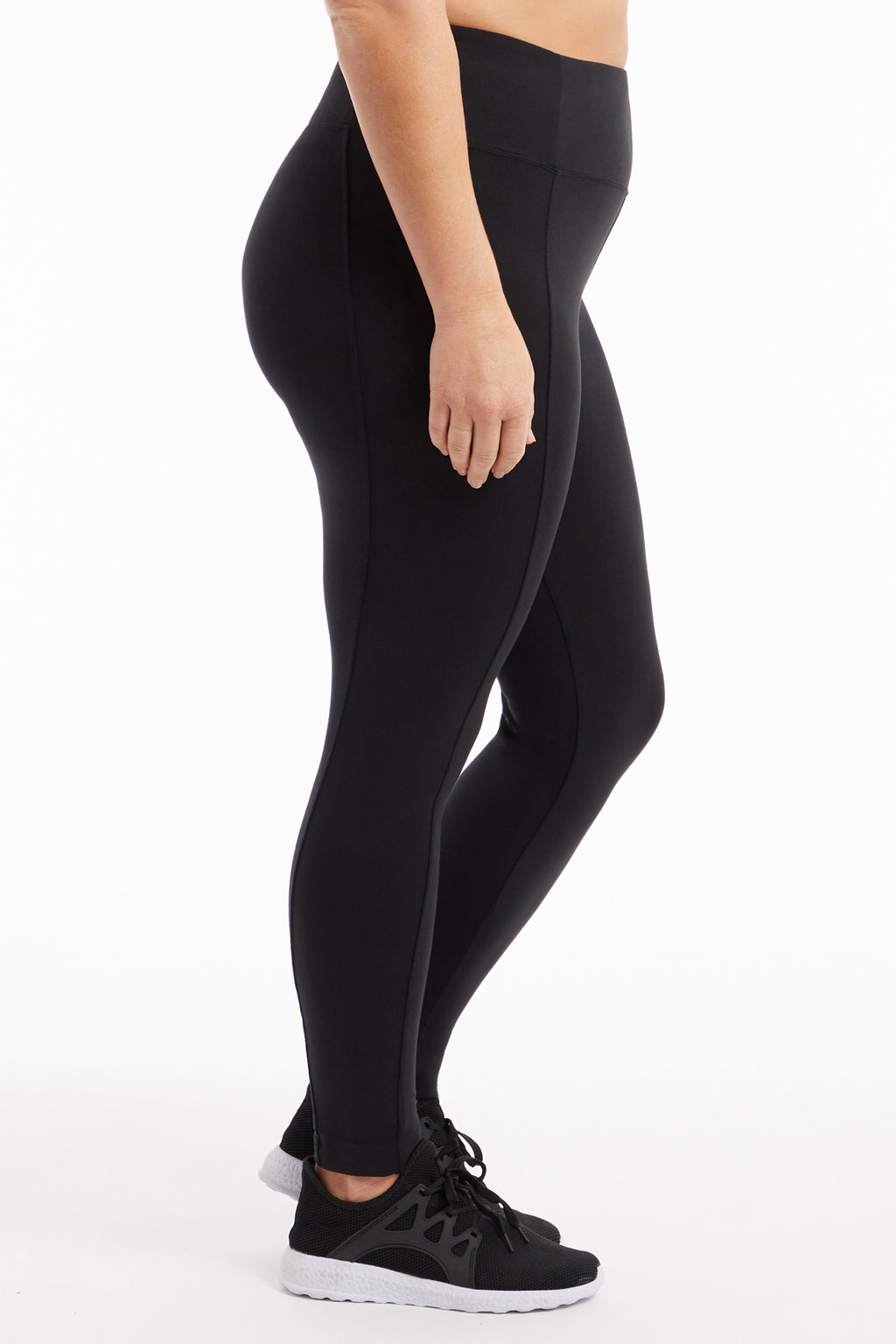 High-Rise Tummy Control Leggings (Plus Size), back view, showing visible design features and texture of the stretch knit fabric.. #color_black