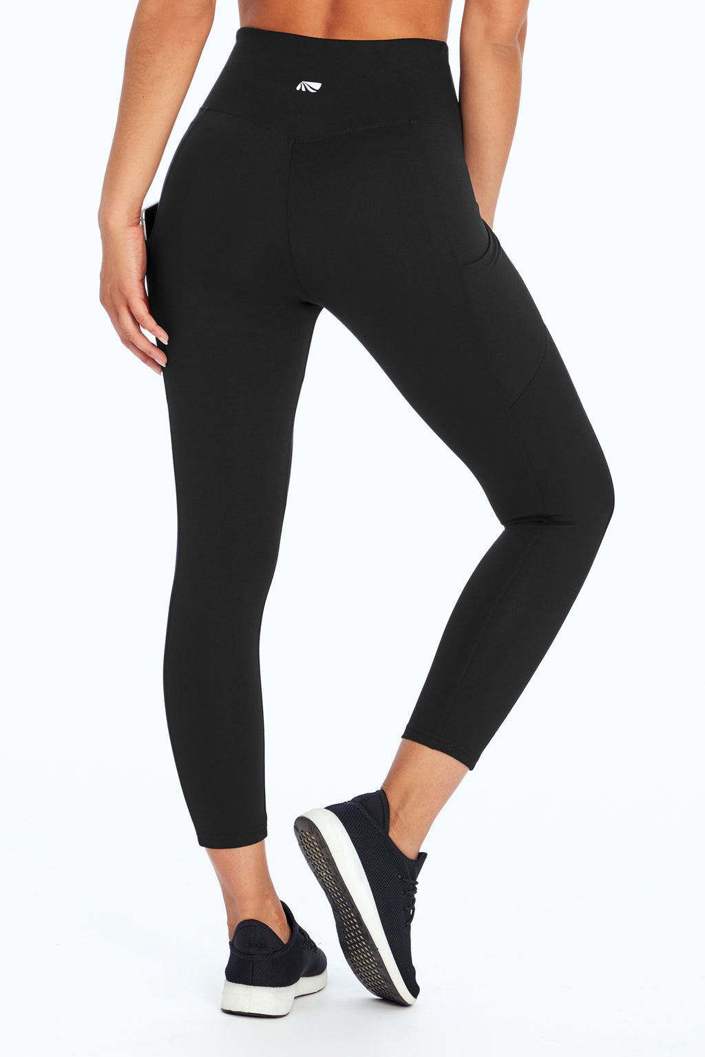 Drew Side Pocket Tummy Control Mid Calf Capri, back view, showing visible design features and texture of the soft knit fabric.. #color_black