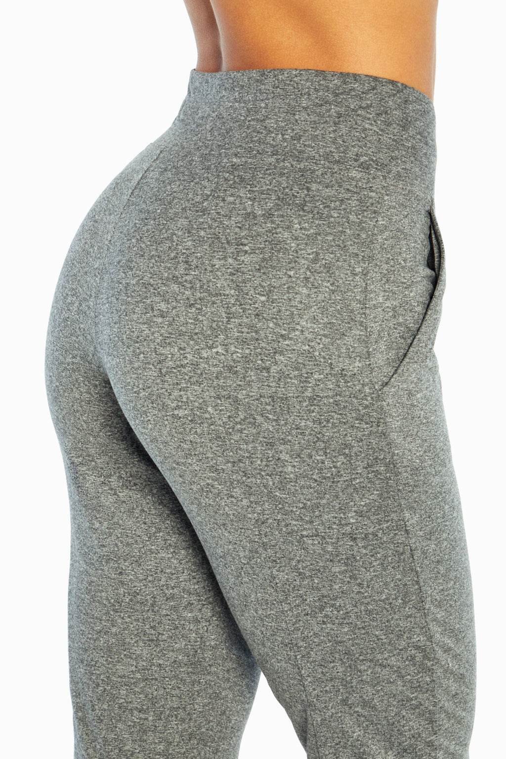 Mona Capri, side view showing pocket placement, showing visible design features and texture of the soft knit fabric.. #color_heather-black
